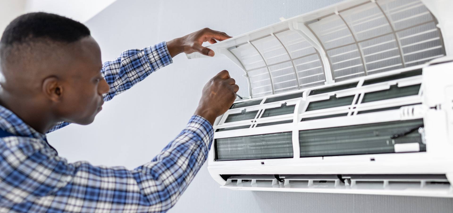 AC Electrician Technician Repairing Air Conditioner