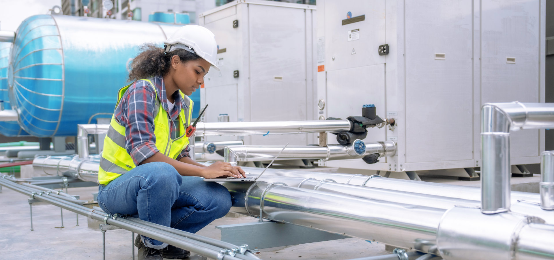 Female engineer inspects and controls the cooling system